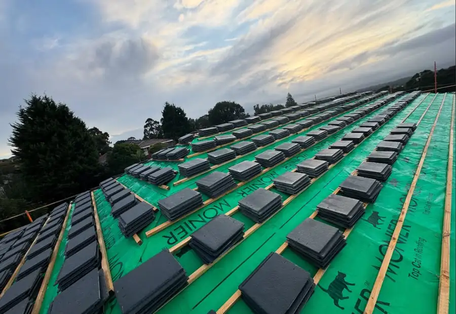 New tiles being laid on a residential roof